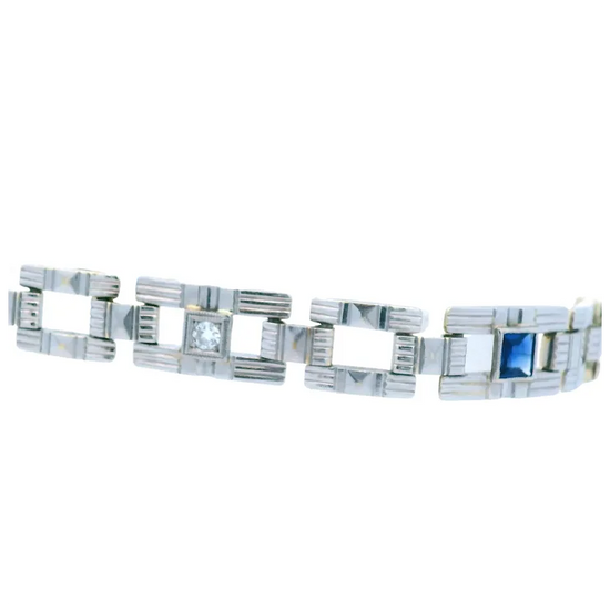 Silver bracelet with geometric design on a white background
