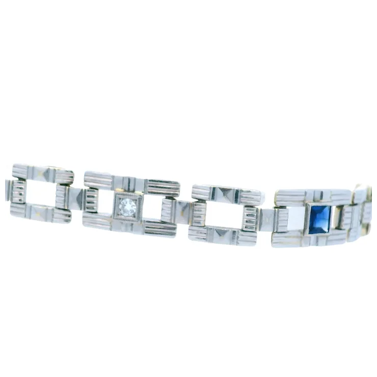 Silver bracelet with geometric design on a white background