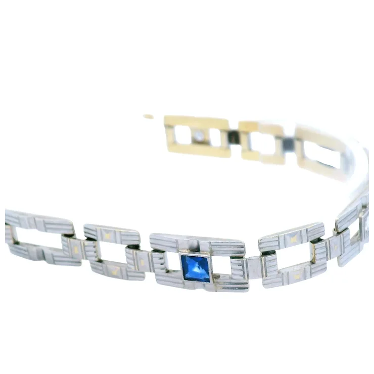 Bracelet with blue gemstone on a white background