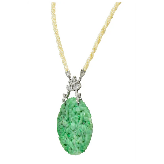 Necklace with a green pendant and yellow beads on a white background
