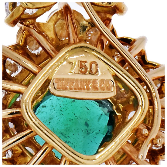 Gold jewelry with a turquoise stone and '750' hallmark