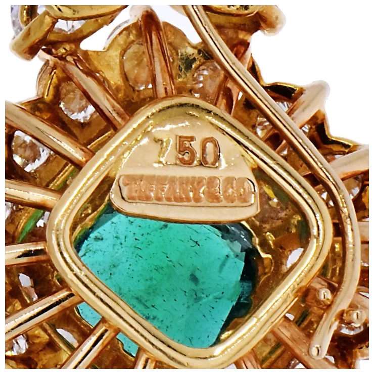 Gold jewelry with a turquoise stone and '750' hallmark