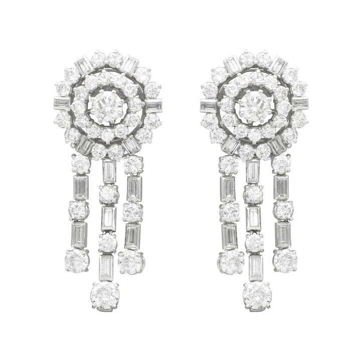 Pair of diamond earrings on a white background