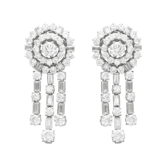 Pair of diamond earrings on a white background