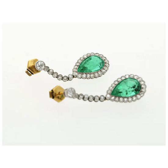 Pair of earrings with green gemstones and gold accents on a white background