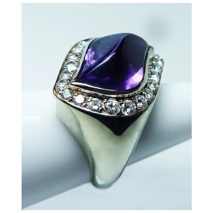 Ring with a purple gemstone and diamond-studded band on a light background