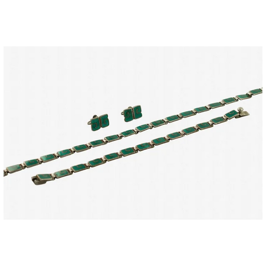 Green jewelry set with bracelet and earrings on a white background