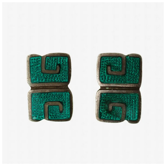 Pair of earrings with green and brown design on a white background