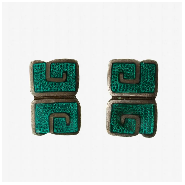Pair of earrings with green and brown design on a white background