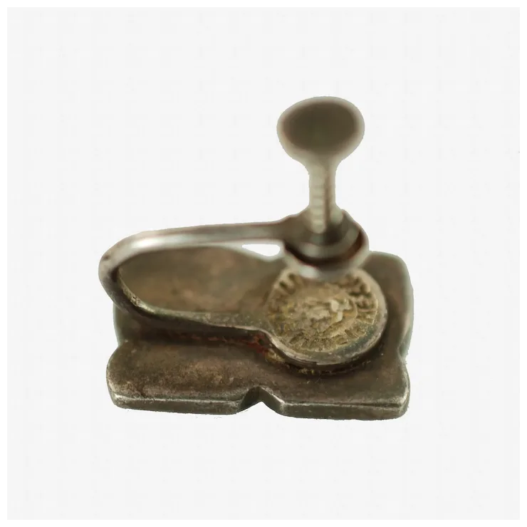 Metallic stamp with a coin on a white background
