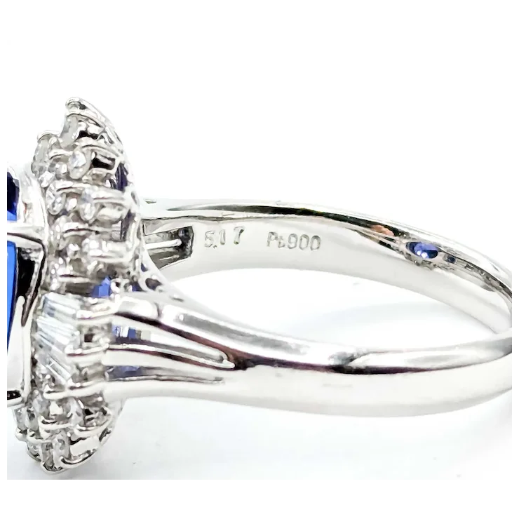 Silver ring with gemstones on a white background