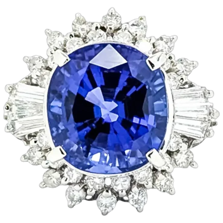 Diamond ring with a blue gemstone on a white background