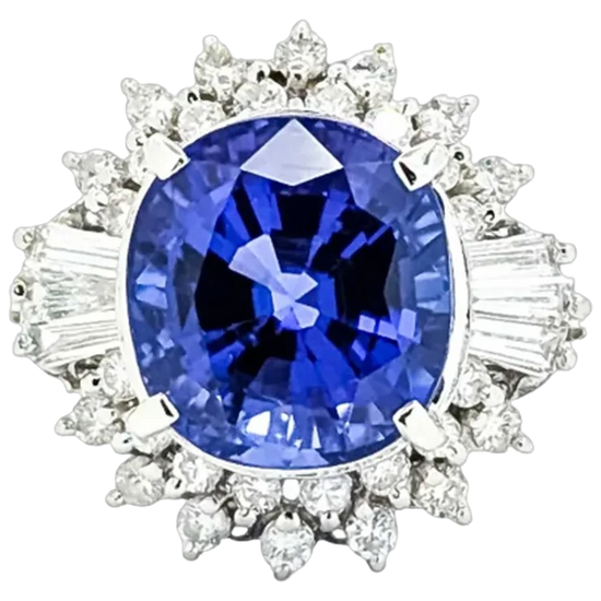 Diamond ring with a blue gemstone on a white background
