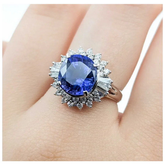 Ring with a blue gemstone on a person's finger