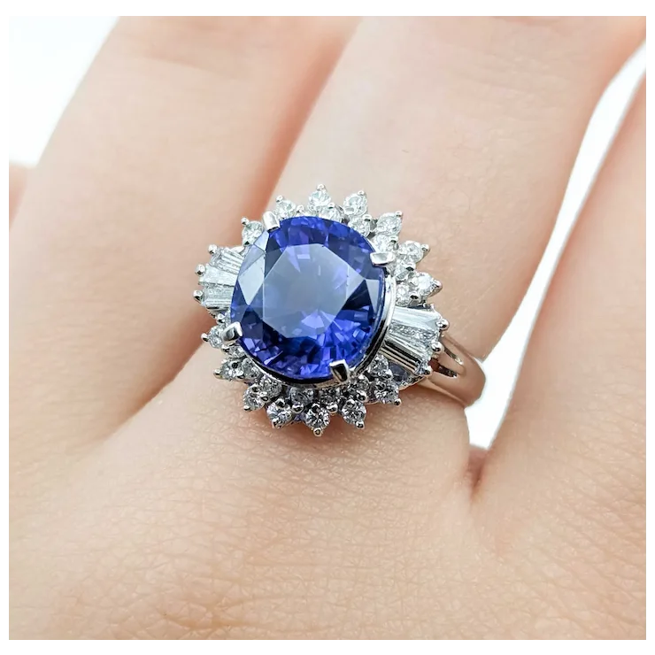 Ring with a blue gemstone on a person's finger