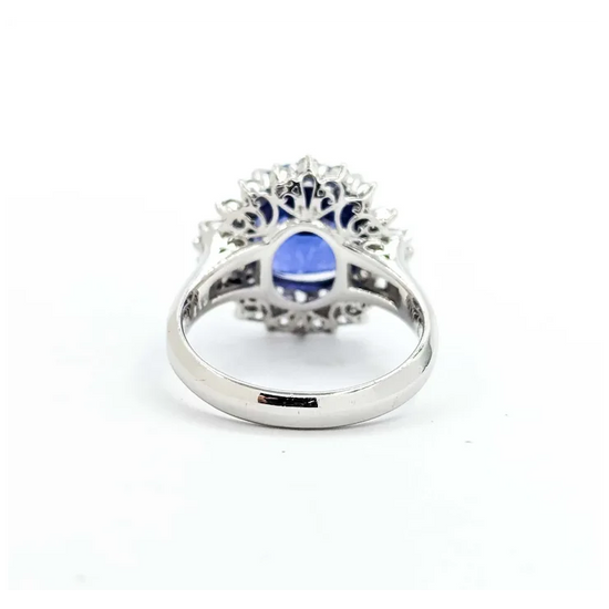 Silver ring with a blue gemstone on a white background